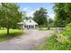 Scenic view of the property highlighting the home, landscaping, and surrounding greenery at 816 Miller Rd, Hillsborough, NC 27278