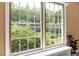 Scenic window view of the lush greenery and landscaping of the property at 816 Miller Rd, Hillsborough, NC 27278