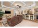 Finished basement with a bar, entertainment area, and elegant ceiling detail at 8405 Hempton Cross Dr, Wake Forest, NC 27587