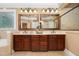 Luxurious bathroom with dual vanities, framed mirrors, and plenty of counter space at 8405 Hempton Cross Dr, Wake Forest, NC 27587