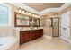 Spacious bathroom featuring dual vanities, a soaking tub, and a glass-enclosed shower at 8405 Hempton Cross Dr, Wake Forest, NC 27587