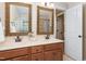 Bright bathroom featuring and sinks, granite countertops, and wooden cabinets at 8405 Hempton Cross Dr, Wake Forest, NC 27587