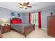 Spacious bedroom with neutral walls, ceiling fan, and carpet floors at 8405 Hempton Cross Dr, Wake Forest, NC 27587