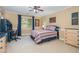 Bright bedroom with neutral walls, ceiling fan, and carpet floors at 8405 Hempton Cross Dr, Wake Forest, NC 27587