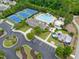Aerial view of the community pool, tennis courts, playground and clubhouse at 8405 Hempton Cross Dr, Wake Forest, NC 27587