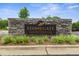 Stonegate Swim and Tennis Club sign is set against a stone wall with landscaped beds at 8405 Hempton Cross Dr, Wake Forest, NC 27587