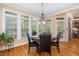 Sunny dining area features large windows and a round table with seating for four at 8405 Hempton Cross Dr, Wake Forest, NC 27587