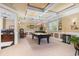 Finished basement game room with pool table and adjoining office space at 8405 Hempton Cross Dr, Wake Forest, NC 27587