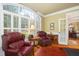 A bright office features hardwood floors, plantation shutters, and is ideal for working from home at 8405 Hempton Cross Dr, Wake Forest, NC 27587