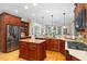 Modern kitchen with stainless steel appliances, a center island, and custom cabinetry at 8405 Hempton Cross Dr, Wake Forest, NC 27587