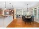 Bright, open-concept kitchen and dining area with hardwood floors and views to the Gathering room at 8405 Hempton Cross Dr, Wake Forest, NC 27587