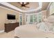 Bright main bedroom features bay window, tray ceiling, and ample space for relaxation at 8405 Hempton Cross Dr, Wake Forest, NC 27587
