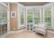 Cozy sitting area off the main bedroom with bay window, chair, and views of the backyard at 8405 Hempton Cross Dr, Wake Forest, NC 27587