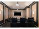 Home theater room featuring tiered seating, projector and surround sound at 8405 Hempton Cross Dr, Wake Forest, NC 27587