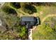 Overhead view of a house with a dark roof and long driveway situated on lush green land at 852 Fred Wilder Rd, Franklinton, NC 27525
