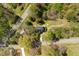 Aerial view of the home nestled in a forested area with access to two roads and a long driveway at 852 Fred Wilder Rd, Franklinton, NC 27525