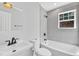 This bathroom features a sink, toilet, and soaking tub with gray tile surround at 852 Fred Wilder Rd, Franklinton, NC 27525