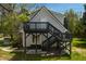 Exterior of home displaying the multiple decks, stairways, and a bright outdoor feel at 852 Fred Wilder Rd, Franklinton, NC 27525