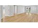 A bright living room features luxury vinyl flooring, and double doors to the backyard at 852 Fred Wilder Rd, Franklinton, NC 27525