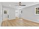 A bright main bedroom features LVP flooring, neutral walls, and two windows at 852 Fred Wilder Rd, Franklinton, NC 27525