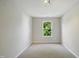 Cozy bedroom with neutral walls, plush carpet and a bright window view at 8621 Neuse Club Ln # 106, Raleigh, NC 27616