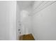A bright walk in closet with white walls, wire shelving, and wood plank flooring at 8621 Neuse Club Ln # 106, Raleigh, NC 27616