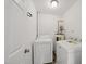 Convenient laundry area with a modern washer, dryer, and water heater at 8621 Neuse Club Ln # 106, Raleigh, NC 27616