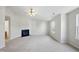 Bright living room with a fireplace and large windows for natural light at 8621 Neuse Club Ln # 106, Raleigh, NC 27616