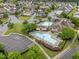 Aerial view of the community pool, clubhouse, and surrounding residences at 9164 Wooden Rd, Raleigh, NC 27617