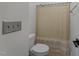 Cozy bathroom with shower and neutral colors offers a relaxing space at 9164 Wooden Rd, Raleigh, NC 27617