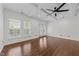 Spacious bedroom with ample natural light and hardwood flooring at 9164 Wooden Rd, Raleigh, NC 27617