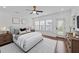 Bright bedroom with hardwood floors, ceiling fan and an abundance of natural light at 9164 Wooden Rd, Raleigh, NC 27617