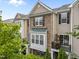 Beautiful exterior elevation with a stone facade and outdoor balcony, perfect for enjoying the neighborhood views at 9164 Wooden Rd, Raleigh, NC 27617