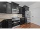 Well-equipped kitchen with stainless steel appliances, dark cabinets, and a functional layout for efficient cooking at 9164 Wooden Rd, Raleigh, NC 27617
