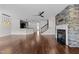 Spacious living room with hardwood floors, open floorplan and fireplace at 9164 Wooden Rd, Raleigh, NC 27617