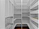 Well-organized walk-in pantry with adjustable shelving, wire baskets, and ample storage space for all your needs at 9164 Wooden Rd, Raleigh, NC 27617