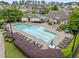 A pristine community pool offers a refreshing retreat with ample lounge seating at 9164 Wooden Rd, Raleigh, NC 27617