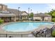 Beautiful community pool with lounge chairs, umbrellas, and well-maintained pool house at 9164 Wooden Rd, Raleigh, NC 27617