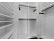 A bright walk-in closet features built-in shelving and racks for optimal storage and organization at 9164 Wooden Rd, Raleigh, NC 27617