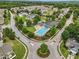 Aerial view of a community pool with a neighborhood surrounding it at 9808 Rainsong Dr, Wake Forest, NC 27587