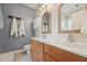 Charming bathroom features double sinks, vanity, and wall-mounted storage at 9808 Rainsong Dr, Wake Forest, NC 27587