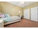 Bedroom featuring light-colored walls, carpet, and furniture, plus a window with natural light at 9808 Rainsong Dr, Wake Forest, NC 27587