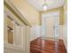 Inviting entryway with hardwood floors and wainscoting at 9808 Rainsong Dr, Wake Forest, NC 27587