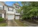 Charming townhome with two-car garage and well-maintained landscaping at 9808 Rainsong Dr, Wake Forest, NC 27587