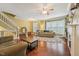 Bright living room with fireplace, hardwood floors, and large windows at 9808 Rainsong Dr, Wake Forest, NC 27587