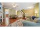 Open-concept living room featuring hardwood floors and staircase at 9808 Rainsong Dr, Wake Forest, NC 27587