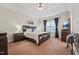 Spacious main bedroom features a trey ceiling, carpet flooring, and bedside tables at 9808 Rainsong Dr, Wake Forest, NC 27587