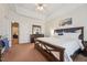 Spacious main bedroom features a trey ceiling, carpet flooring, and matching furniture at 9808 Rainsong Dr, Wake Forest, NC 27587