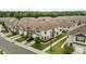 Aerial view of modern townhomes in a well-maintained community with lush landscaping at 1102 Latitude Dr, Durham, NC 27713