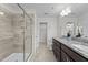 Primary bath with a glass shower, double sink granite vanity, and ample space at 1102 Latitude Dr, Durham, NC 27713